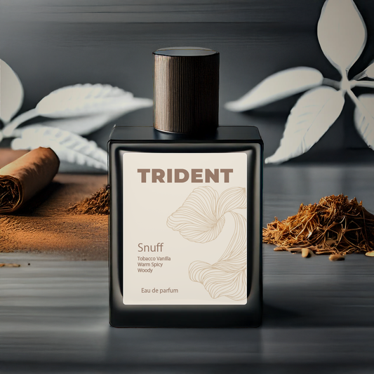 Trident snuff eau de parfum bottle with leaves and tobacco on a dark background