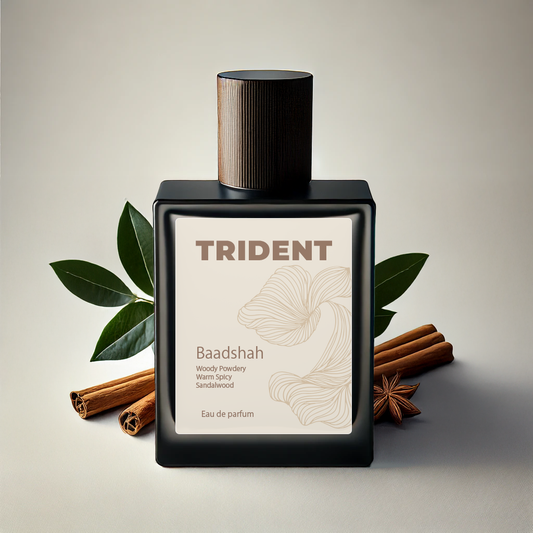 Trident Baadshah perfume bottle with leaves and cinnamon sticks on a beige background