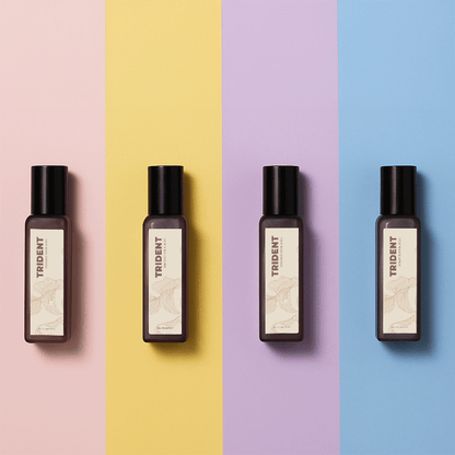 Four 20 ml bottles of Trident perfumes on a multicolored background