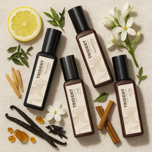 Office Elegance 4 pack 20ml bottles by trident perfumes surrounded by cinnamon sticks, woodbarks, flowers, citrus lemon and leaves