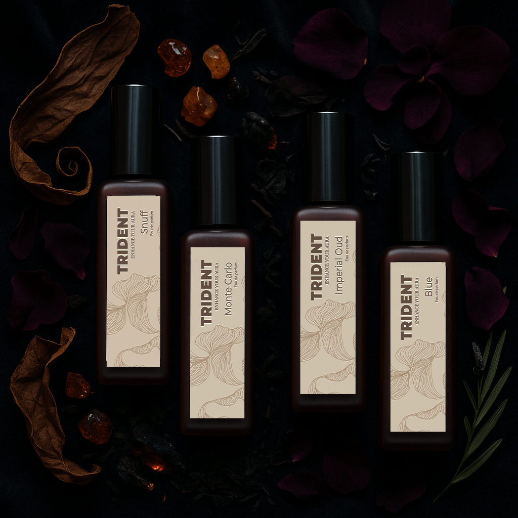 Power Night Pack Bundle of 4 20 ML bottles from Trident Perfumes surrounded by amber crystals, leaves, woody leaves