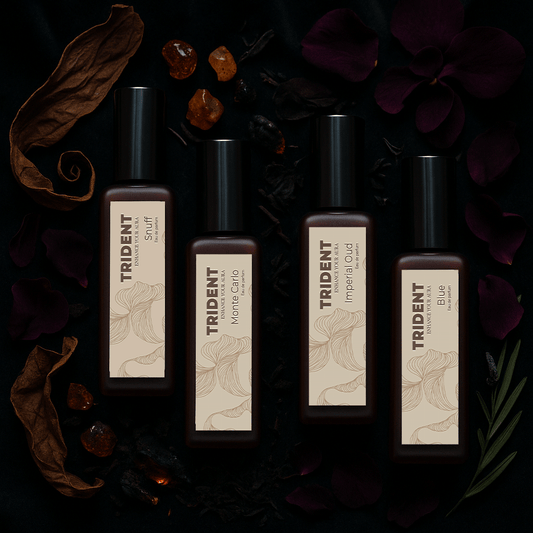 Power Night Pack Bundle of 4 20 ML bottles from Trident Perfumes surrounded by amber crystals, leaves, woody leaves